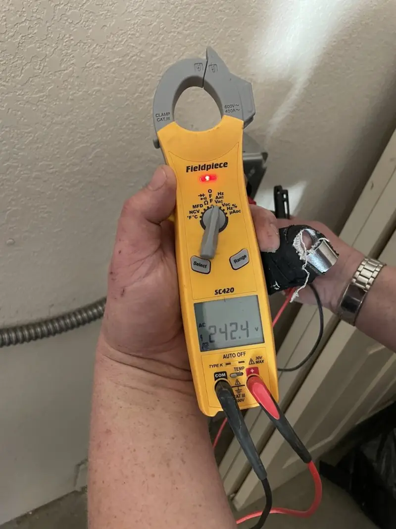 Voltage testing with clamp meter during Recessed Lighting Installation in Southwick